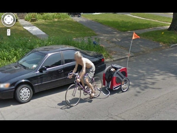 Shirtless Man Giving His Dog a Ride