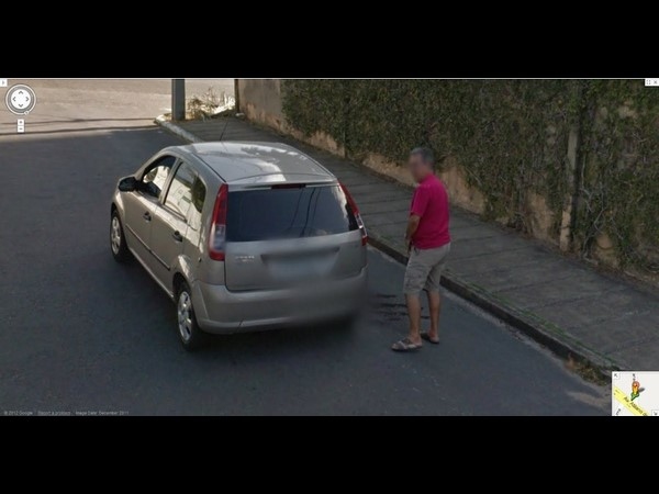 Man Peeing on a Car