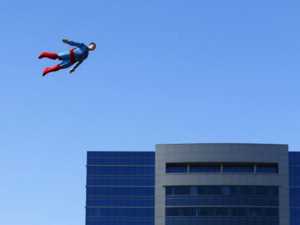 Radio controlled superman soaring over san diego