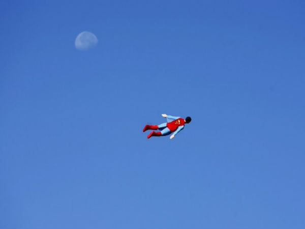 Radio controlled superman soaring over san diego