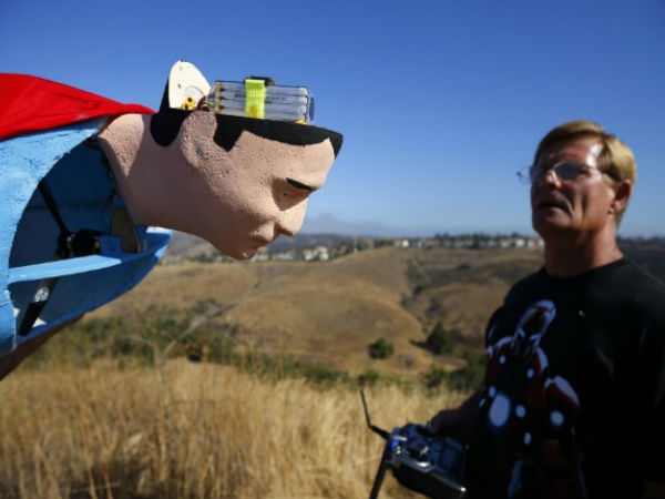 Radio controlled superman soaring over san diego