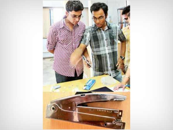 3. A dual pin stapler